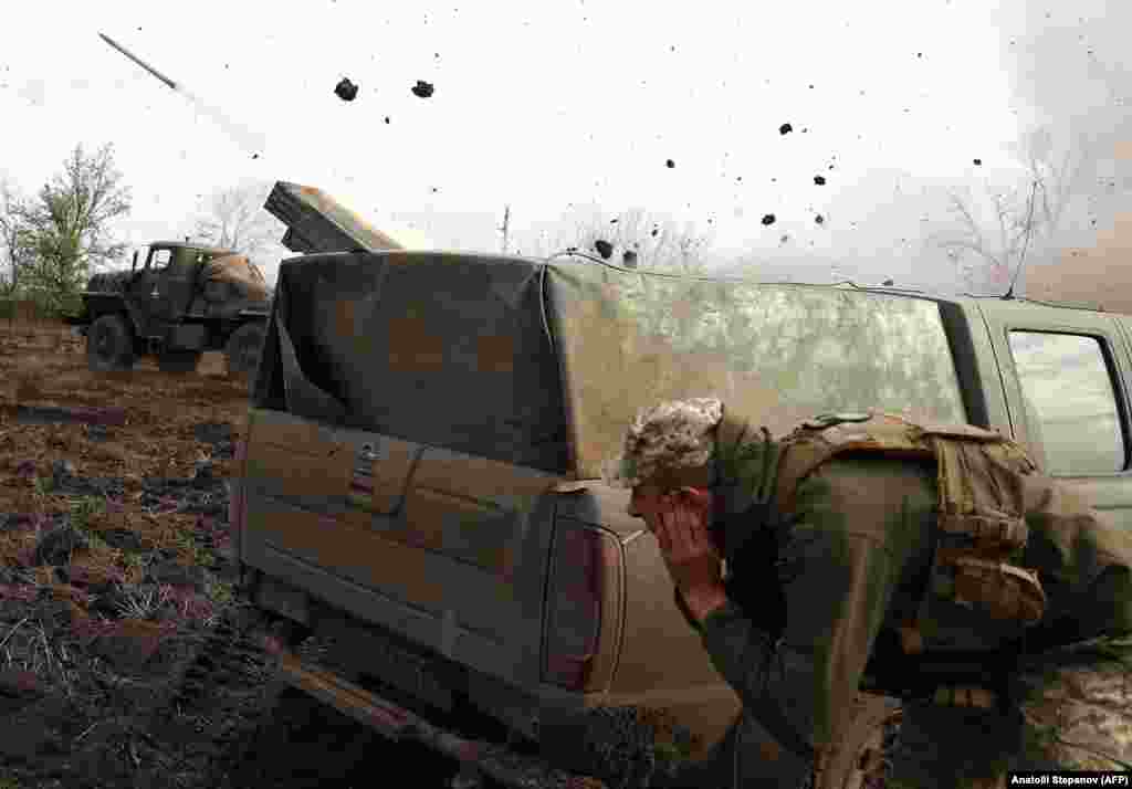 Ukrainian troops fire a BM-21 Grad multiple-rocket launcher toward Russian positions on the front line near Bakhmut in the Donetsk region on April 18. Moscow&#39;s forces are stepping up their use of heavy artillery and air strikes in the devastated eastern city of Bakhmut, the commander of Ukraine&#39;s ground forces said on April 18.