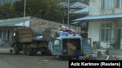 Nagorno-Karabakh - A view through a car window shows abandoned vehicles in Stepanakert an Azeri military operation and mass exodus of ethnic Armenians from the region, October 2, 2023.