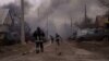 Ukrainian firefighters struggle to keep up with blazes caused by the battles around Bakhmut on March 13.