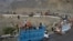 Trucks transporting Afghan refugees with their belongings are seen along a road toward the Pakistan-Afghanistan Torkham border, following Pakistan's government decision to expel people illegally staying in the country.