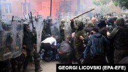 Soldiers of NATO-led international peacekeeping Kosovo Force (KFOR) scuffle with ethnic Serbs in front of the building of the municipality in Zvecan, Kosovo, on May 29, 2023. 