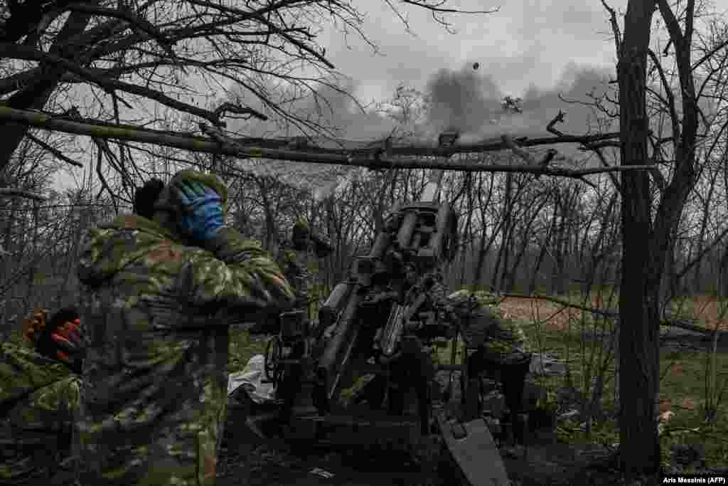 Ukrainian soldiers fire at Russian positions with a 155mm M777 howitzer. Kyiv announced last week that it had decided to defend Bakhmut rather than withdraw its forces. The battle over the shattered landscape of Bakhmut, described by both sides as &quot;a meat grinder,&quot; has become Europe&#39;s bloodiest since World War II.