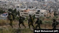 گروهی از سربازان اسرائیلی در بخشی از شهر غزه 