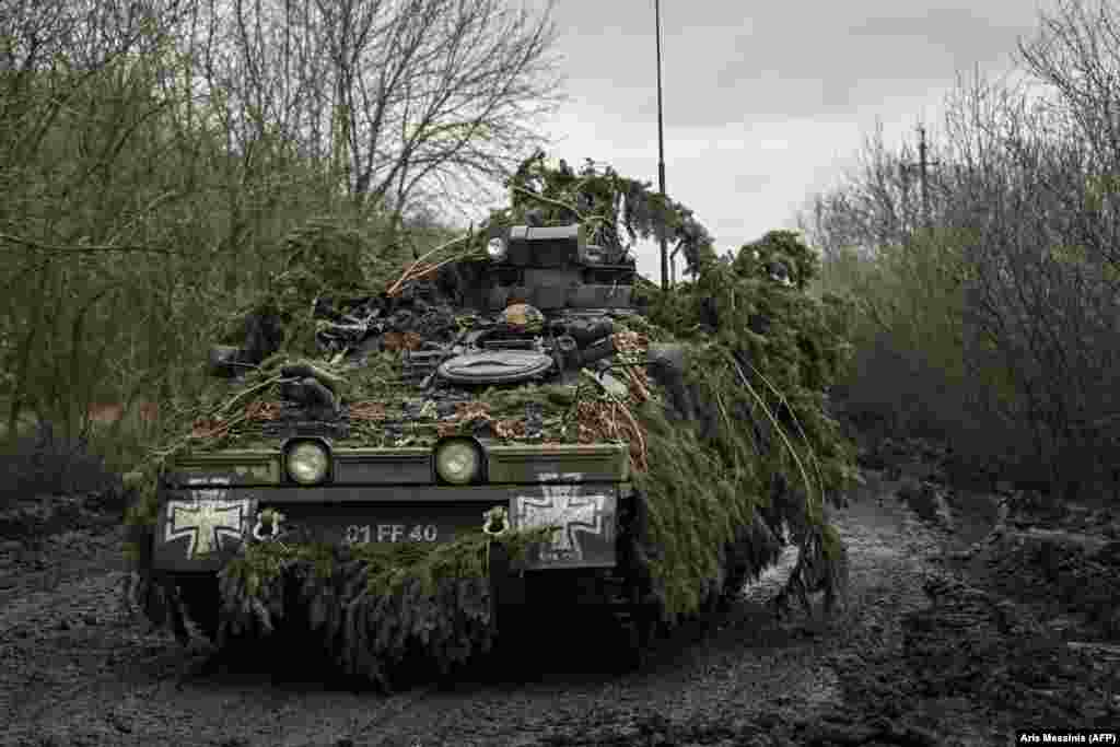 An armored vehicle driven by Ukrainian soldiers heads toward the city of Bakhmut.