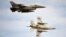 Romanian air force F-16 fighter jets fly above the Baza 86 military air base. (file photo)