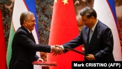 Özbəkistan prezidenti Şavkat Mirziyoyev və Çin Xalq Respublikasının sədri Si Cinpin Çin-Mərkəzi Asiya Sammitində.