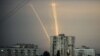 Russian rockets launches against Ukraine from Russia's Belgorod region are seen at dawn in Kharkiv on August 15.