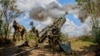 Ukrainian soldiers operate a U.S.-made 155mm M777 howitzer at their position in the Kharkiv area of Ukraine on July 28.