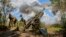 Ukrainian soldiers operate a U.S.-made 155mm M777 howitzer at their position in the Kharkiv area of Ukraine on July 28.