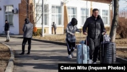 A man passes through a Romania-Ukraine border-crossing point in February 22, shortly after the start of Russia's full-scale invasion. 