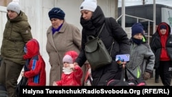 Біженці з України на українсько-польському кордоні. 2022