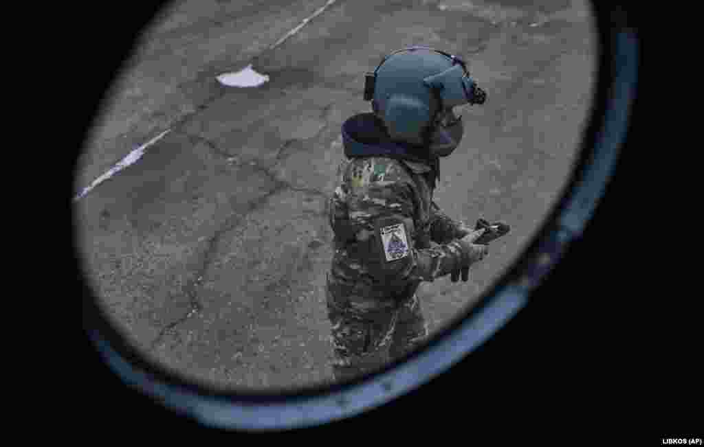 A pilot does a final inspection before taking off for a combat mission. Besides hardware fatigue, artillery and shoulder-fired anti-aircraft missiles pose a serious threat to Ukraine&#39;s aged combat helicopters, which must fly low and fast when conducting air-assault operations.