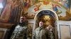 Ukrainian military personnel arrive in the Dormition Cathedral of the Kyiv-Pechersk Lavra, where Metropolitan Epiphany held a Christmas service according to the Julian calendar in Kyiv on January 7.