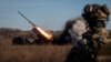 Ukrainian soldiers fire a Bureviy multiple-launch rocket system at a position in the Donetsk region on November 29.