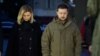 Ukrainian President Volodymyr Zelenskiy and his wife, Olena, pay their respects to the victims of the Holodomor famine at a memorial in central Kyiv on November 26. 
