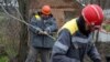 Workers repair broken power lines in a village in Ukraine's Donetsk region amid the Russian invasion of the country. 