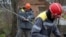 Workers repair broken power lines in a village in Ukraine's Donetsk region amid the Russian invasion of the country. 