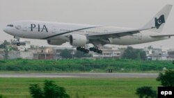 A woman was killed late 24 June 2014 when shots were fired at an aircraft minutes before it landed at an airport in the north-western Pakistani city of Peshawar.