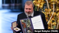 Dmitry Muratov is presented with a diploma and gold medal at the 2021 Nobel Peace Prize award ceremony in Oslo in December 2021.