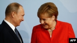 Анґела Меркель та Володимир Путін