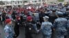 Armenia - Security forces disperse opposition protesters blocking a street in Yerevan, May 2, 2022.