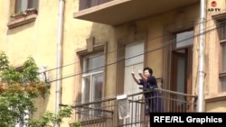 Armenia -- A screenshot of a video that shows the mother of parliament speaker Alen Simonian giving opposition protesters the middle finger, Yerevan, May 6, 2022