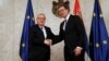 European Commission President Jean-Claude Juncker (left) shakes hands with Serbian President Aleksandar Vucic in Belgrade on February 26.
