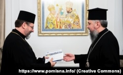 Предстоятель ПЦУ митрополит Київський і всієї України Епіфаній (праворуч) і глава УГКЦ Святослав. Київ, 24 грудня 2022 року