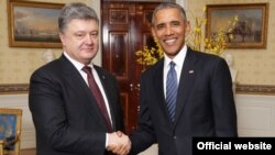 U.S. President Barack Obama greets Ukrainian President Petro Poroshenko at the Nuclear Security Summit in Washington on April 1.