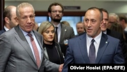 Kosovo's Prime Minister Ramush Haradinaj (right) and Foreign Minister Behgjet Pacolli attend the meeting in Brussels on December 17.