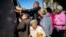 Locals line up to receive food and everyday necessities given by Ukrainian volunteers in Izyum, where residents have been living without gas, electricity, or running water supply since the beginning of September. 
