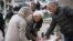 Residents in Gracanica, a majority-Serb municipality outside Kosovo's capital, sign a petition on local issues on October 3. 