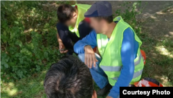 Мариуполдо иштеген борбор азиялык мигранттар.