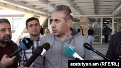 Armenia - Anti-government activist Edgar Ghazarian speaks to journalists outside a hospital in Yerevan, October 18, 2022.