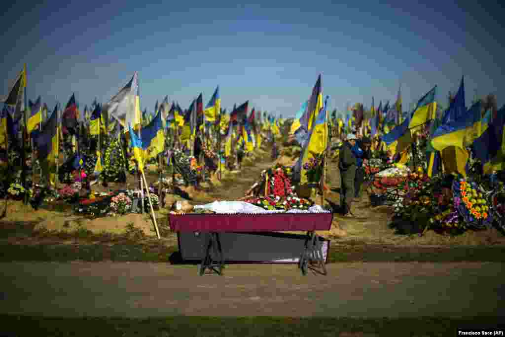 The body of Ukrainian soldier Vadym Bereghnuy, 22, awaits burial at a cemetery in Kharkiv on October 17, 2022.