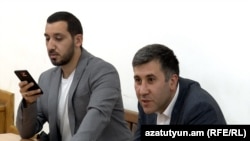 Armenia - Opposition activist Samvel Vartanian (left) and his lawyer Ruben Melikian attend a court hearing in Yerevan, April 8, 2025. 