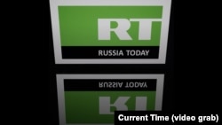 RT телеканалынын логотиби.