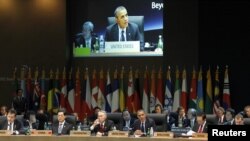 Сеулдагы жыйындын катышуучулары АКШ президенти Барак Обаманын сөзүн тыңдашууда. 27-март, 2012