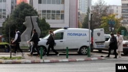 Police help evacuate a high school in Skopje due to a bomb threat, one of many that have plagued North Macedonia in recent months. (file photo)