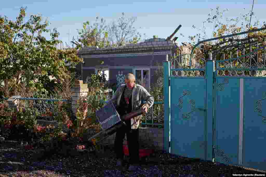 A local man in Prybuzke after receiving a stove. Slava, a Ukrainian volunteer for OperationAid, told RFE/RL that, while residents are happy to receive food and water, the stoves elicit a much stronger response. &quot;People... maybe cry, it&#39;s very necessary for survival now,&quot; he says.&nbsp;&nbsp;