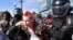 Riot police detain a protester in Moscow. State media have sought to portray the demonstrators as radicals or misfits.