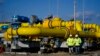 Employees walk at the construction site of a gas metering station, part of the pipeline link between Bulgaria and Greece near the village of the Malko Kadievo, on March 18.