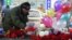 A man places a toy at the site, where a woman suspected of killing a child was detained in Moscow on February 29. Despite the shocking nature of the story, none of Russia's main TV channels covered it. 
