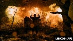 Ukrainian soldiers fire artillery at Russian positions near Bakhmut in the eastern Donetsk region on November 20.