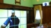Russian opposition leader Alexei Navalny is seen on a screen via video link before a court hearing to consider an appeal against his prison sentence on May 17.