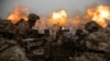 Ukrainian servicemen fire at Russian positions on the front line near the town of Bakhmut. 