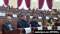 Armenia - Aghasi Matevosian (left) attends a session of Gyumri's municipal council.