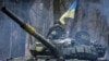 A Ukrainian T-72 tank maneuvers through the trees in the Donetsk region of eastern Ukraine on January 18.