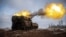 Ukrainian troops fire from a Polish Krab self-propelled howitzer toward Russian positions on the front line in the Donetsk region on January 17.