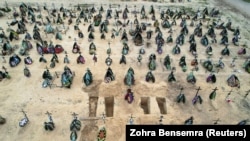 Rows of new graves for those killed during Russia's invasion of Ukraine at a cemetery in Irpin, near Kyiv, on April 18. Russia has told its media to refer to its action in Ukraine as "a special operation" and not a war.